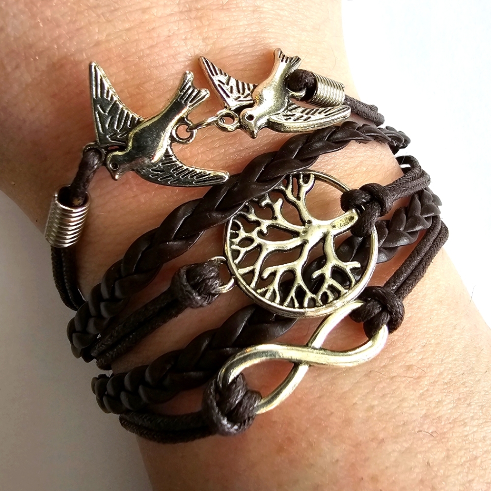 Bracelet with Peace sign, infinity symbol, and tree charms brown silver tone